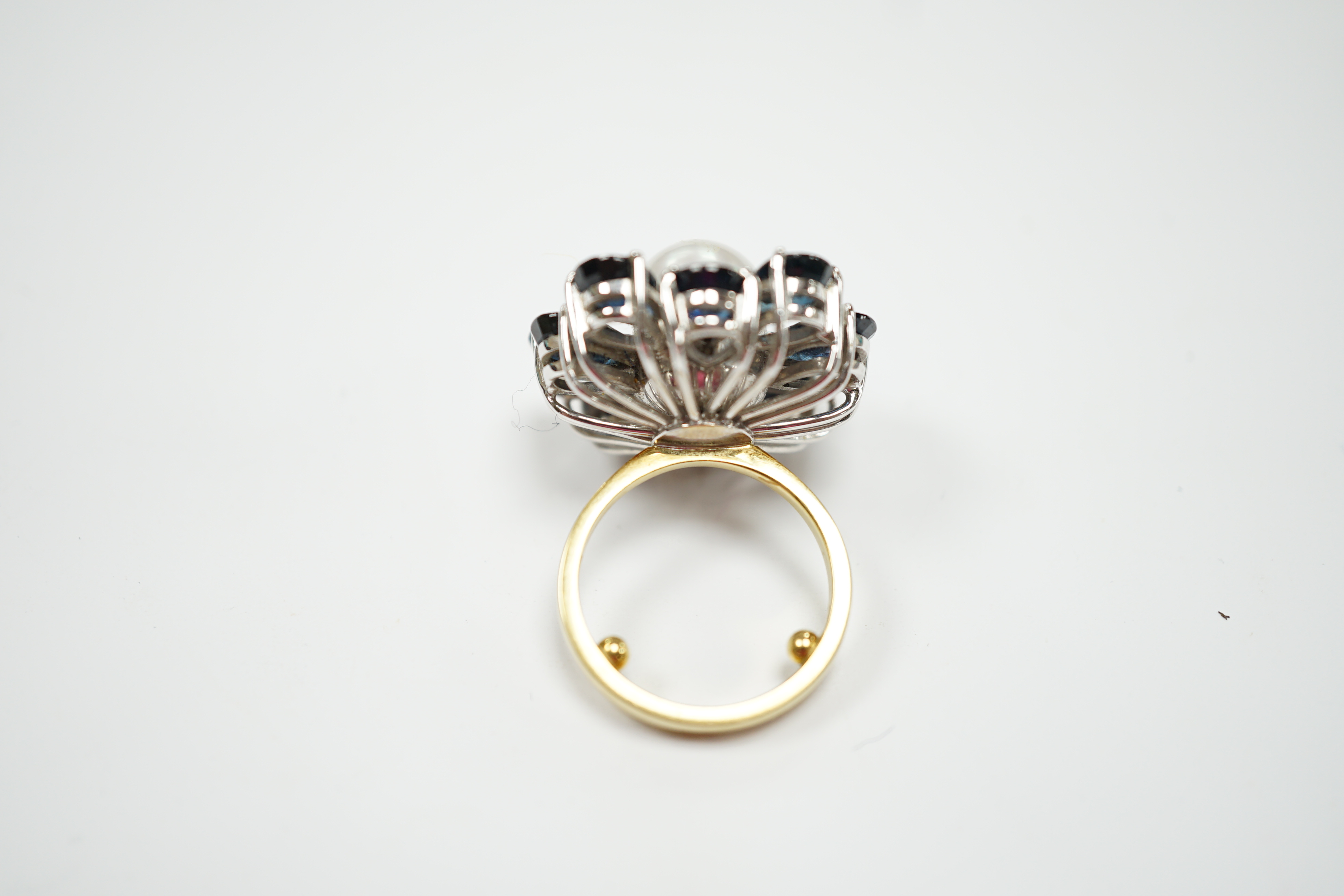 A modern large 18ct gold, single stone cultured pearl and ten stone pear cut sapphire set flower head cluster ring, size G, gross weight 15.4 grams.